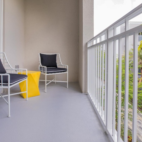 a couple of chairs on a balcony