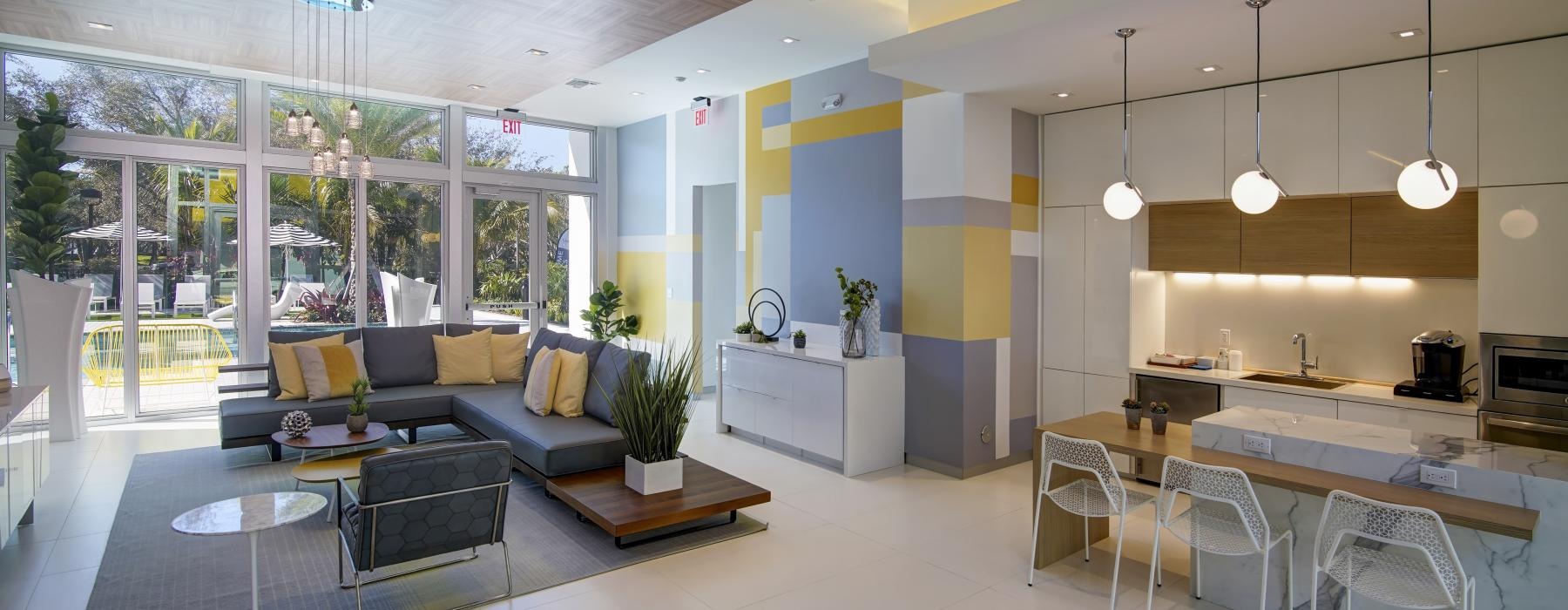 a modern looking lounge room with large windows