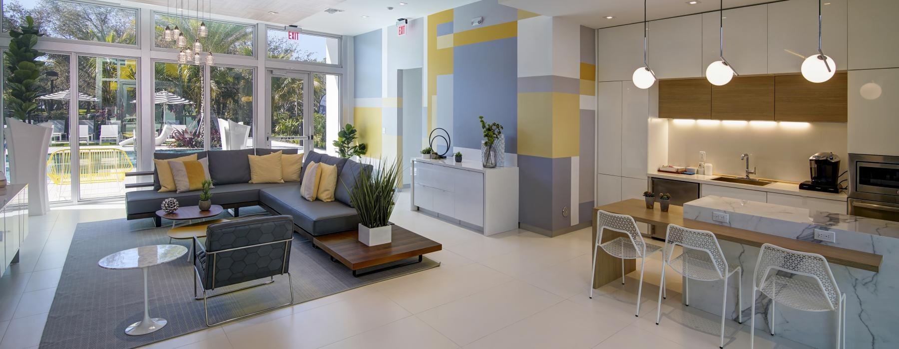 a modern looking lounge room with large windows